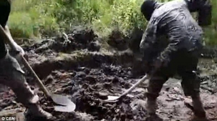 Traumatic footage shows 'Ukrainian soldiers burying a Russian separatist ALIVE' 