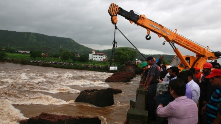 14 bodies found after a bridge collapsed in India, sending vehicles into water