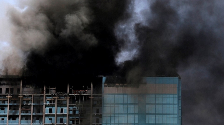 Smoke billows from skyscraper as firefighters battle huge blaze in Abu Dhabi