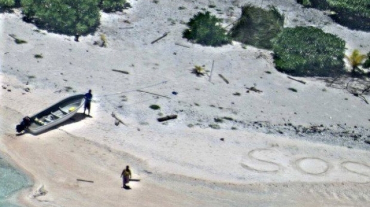 'SOS' in sand leads to rescue of 2 people stranded on Pacific island