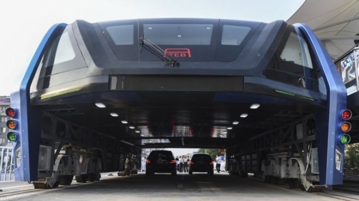 China's futuristic 'straddling bus' hits the road