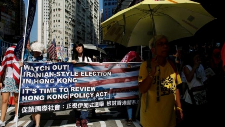 Hong Kong citizens take to streets, protesting against China's interference into elections