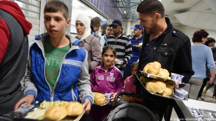 Merkel urges big company bosses to help hire refugees. What's key hindrance?