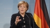 Merkel regrets her open-door policy concerning migrants; braces for fourth term