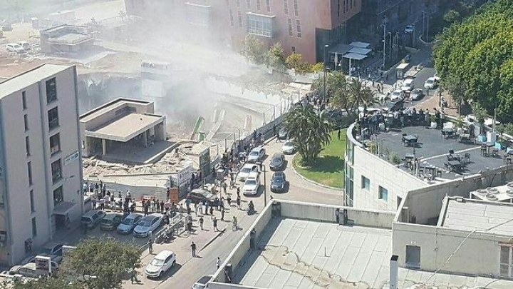 Many injured and at least 15 trapped in Tel Aviv building collapse