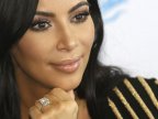 Kim Kardashian West sues gossip website over claims she faked robbery