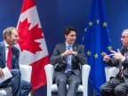 EU and Canada sign free trade agreement to be ratified by 40 national and regional legislatures in Europe