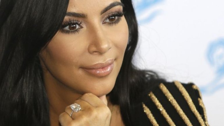 Kim Kardashian West sues gossip website over claims she faked robbery