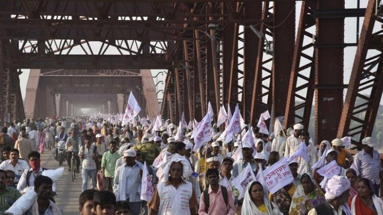 Stampede in northern India kills more than 20 at religious ceremony