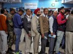 Cash for queues: people paid to stand in line amid India's bank note crisis