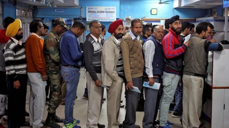 Cash for queues: people paid to stand in line amid India's bank note crisis