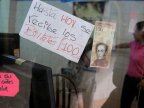 Venezuelans line at banks to give 100-bolivar bills after presidential ban