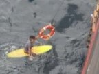 Japanese man rescued after night at sea on surfboard