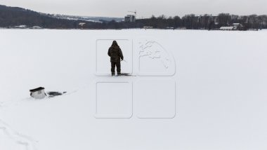 Fishing in cold at ice hole: It’s my hobby