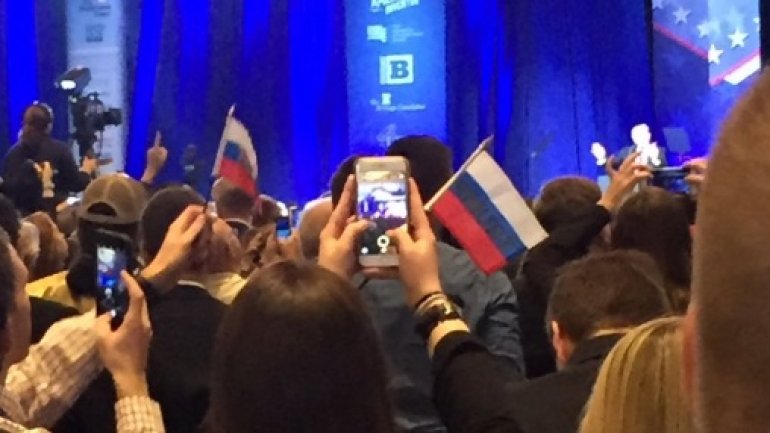 Crowd waves Russian flags in support of Donald Trump at rally