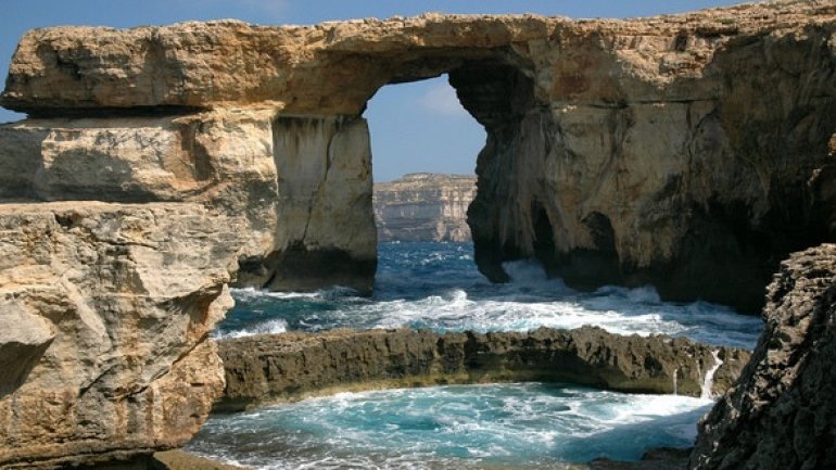 Azure Window rock formation near Malta FALLS into Mediterranean