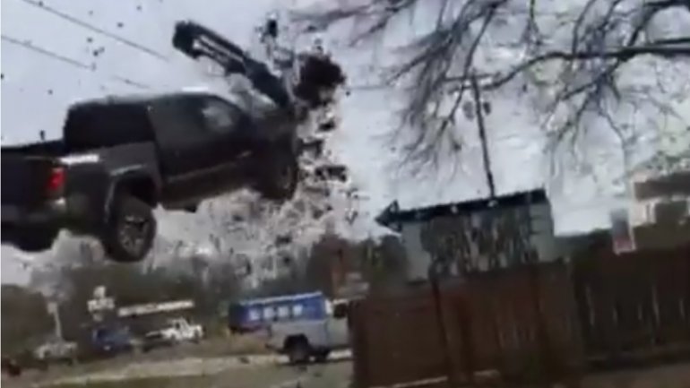 Truck chased by police launches into air, after hitting spike strip (VIDEO)