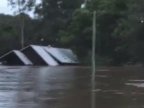 Australia floods: House washed away after family's rescue 