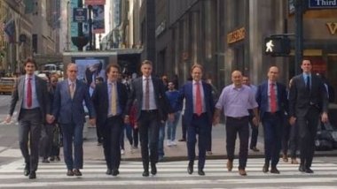 Dutch men hold hands to protest against homophobia