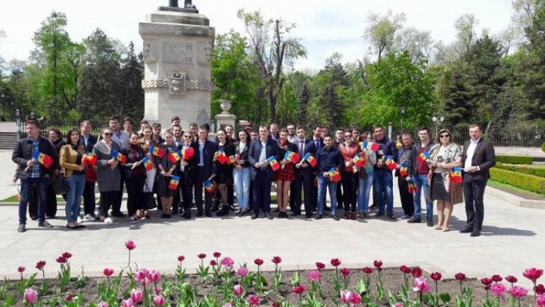 Young Democrats distribute flags on National Flag Day