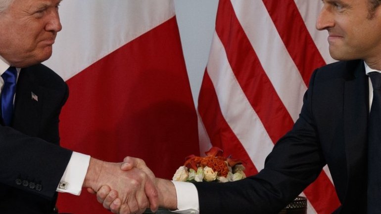 President Trump, French leader Macron lock hands for so long that their knuckles turn white