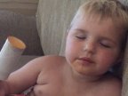 HILARIOUS moment sleepy four-year-old boy struggles to stay awake while licking his lolly (VIDEO)