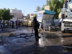 30 die as woman blasts explosive in Iraqi market