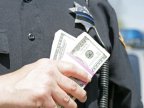 Police officer, ACCUSED of bribery, DETAINED by National Anticorruption Center