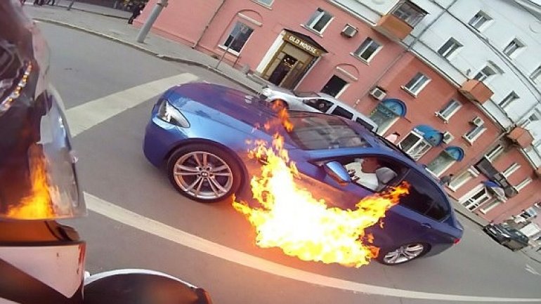 Russian man somehow escapes UNHURT after his BMW randomly burst into flames (VIDEO)