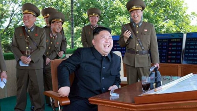 North Korean dictator GRINS as fighter jet DESTROYS enemy aircraft in war games