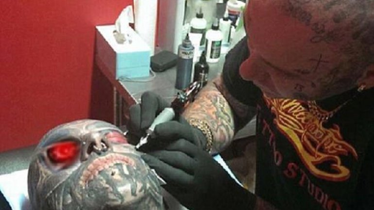 Meet the ink-addict covered HEAD-TO-TOE in $100,000 worth of tattoos including one on his EYEBALL (PHOTO/VIDEO)