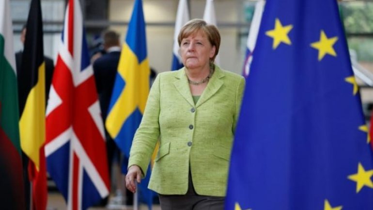 Merkel's conservatives widen lead three months before German vote 