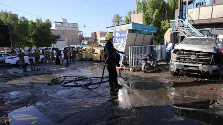 30 die as woman blasts explosive in Iraqi market