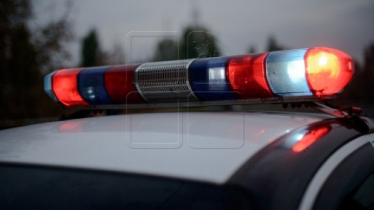 Two men run after seeing police officers near construction sight in Chisinau