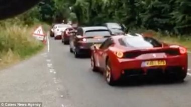 Is this the world's most expensive traffic jam? Stunned lorry driver spots 36 Ferraris worth a total of £7.2M queuing up at temporary lights