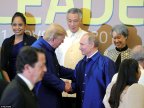 Trump and Putin continue Bill Clinton's tradition by wearing traditional Vietnamese silk shirts at APEC conference 