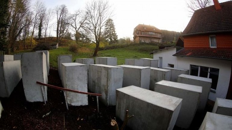 Activists mock German far-right politician, by building Holocaust memorial replica outside his home