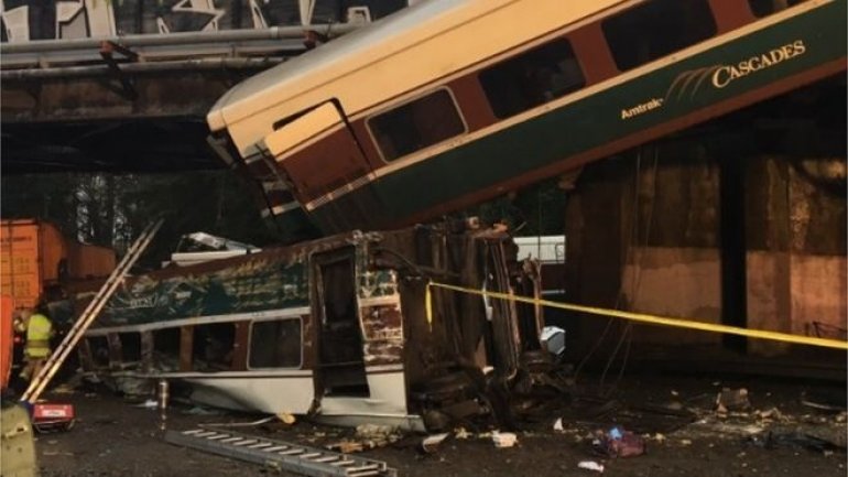 Train carriages plunged on US motorway after crash in Washington 