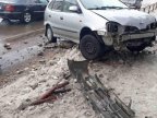 Icy road, actual problem. Car skidded and hit fence as consequence of snowfall 