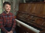 Small boy with big dreams. 11-year-old Emanuel Oleinic dreams to sing in world's biggest opera houses