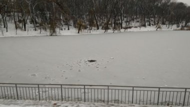 Danger in Rose Valley Park: Children playing on thin ice layer of lake