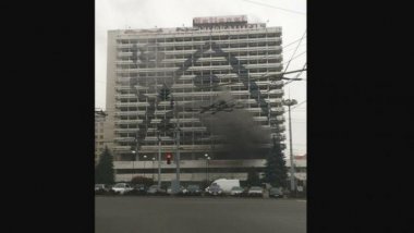 National hotel is on fire. Firemen and police are already there