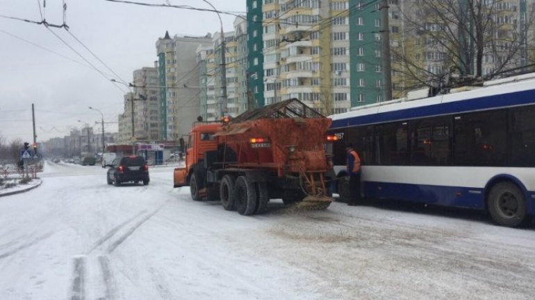 Winter streets troubling Chisinau traffic. Exdrupo specialized vehicles operating non-stop 