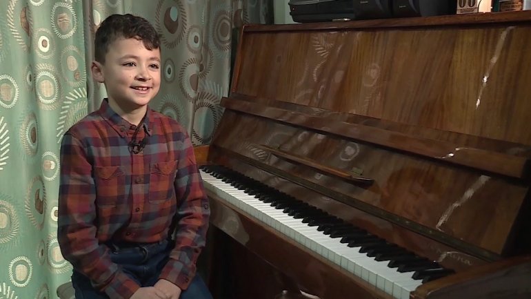 Small boy with big dreams. 11-year-old Emanuel Oleinic dreams to sing in world's biggest opera houses