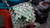 Street seller from Venezuela crafts origami-style items out of money