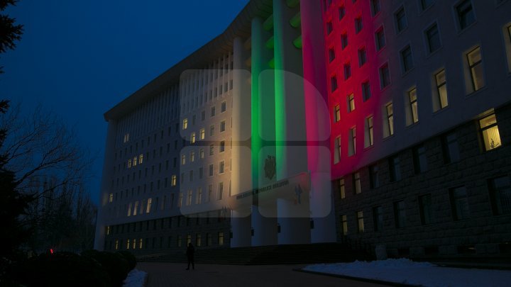 Lights spectacle in the square of Moldovan Parliament. Building was illuminated in Lithuanian flag colors