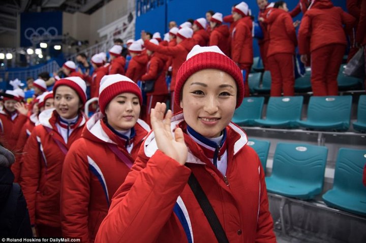 North Korean cheerleaders who have become viral sensation Winter Olympics watched over by ruthless masked minders who stop them from speaking to ordinary people