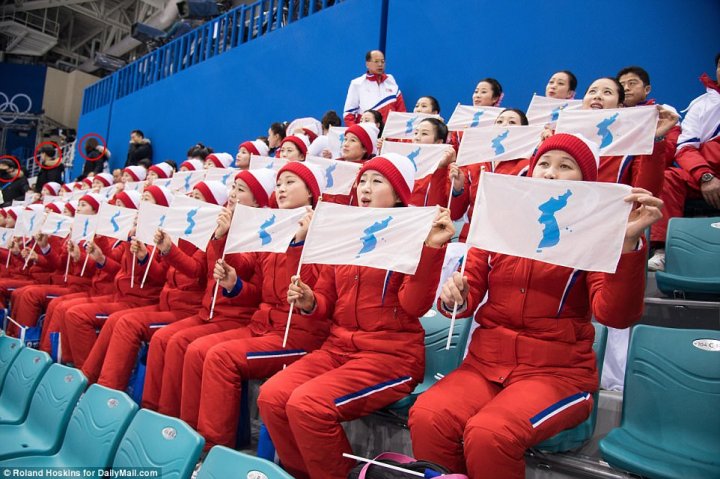 North Korean cheerleaders who have become viral sensation Winter Olympics watched over by ruthless masked minders who stop them from speaking to ordinary people