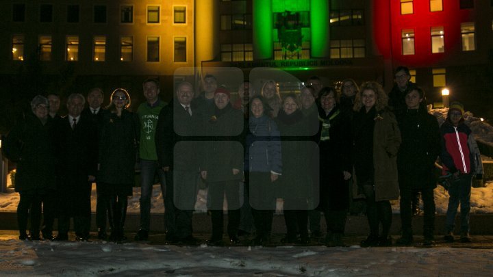 Lights spectacle in the square of Moldovan Parliament. Building was illuminated in Lithuanian flag colors