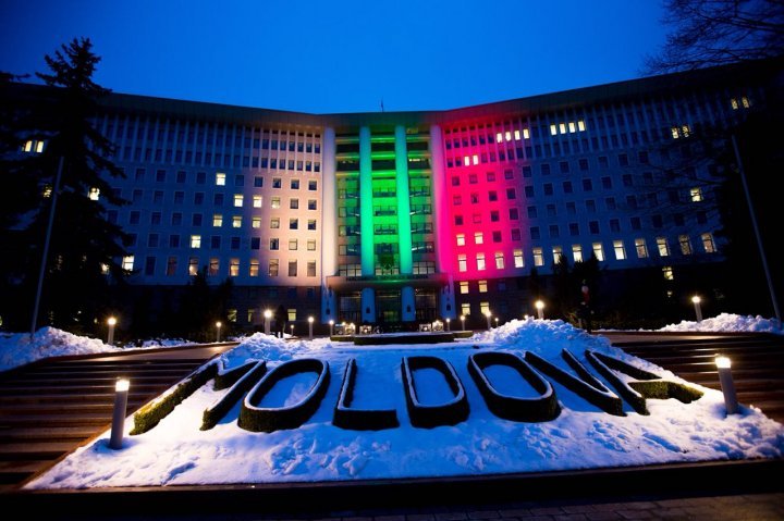 Lights spectacle in the square of Moldovan Parliament. Building was illuminated in Lithuanian flag colors